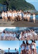 A group of women in white bathing suits posing for a picture.